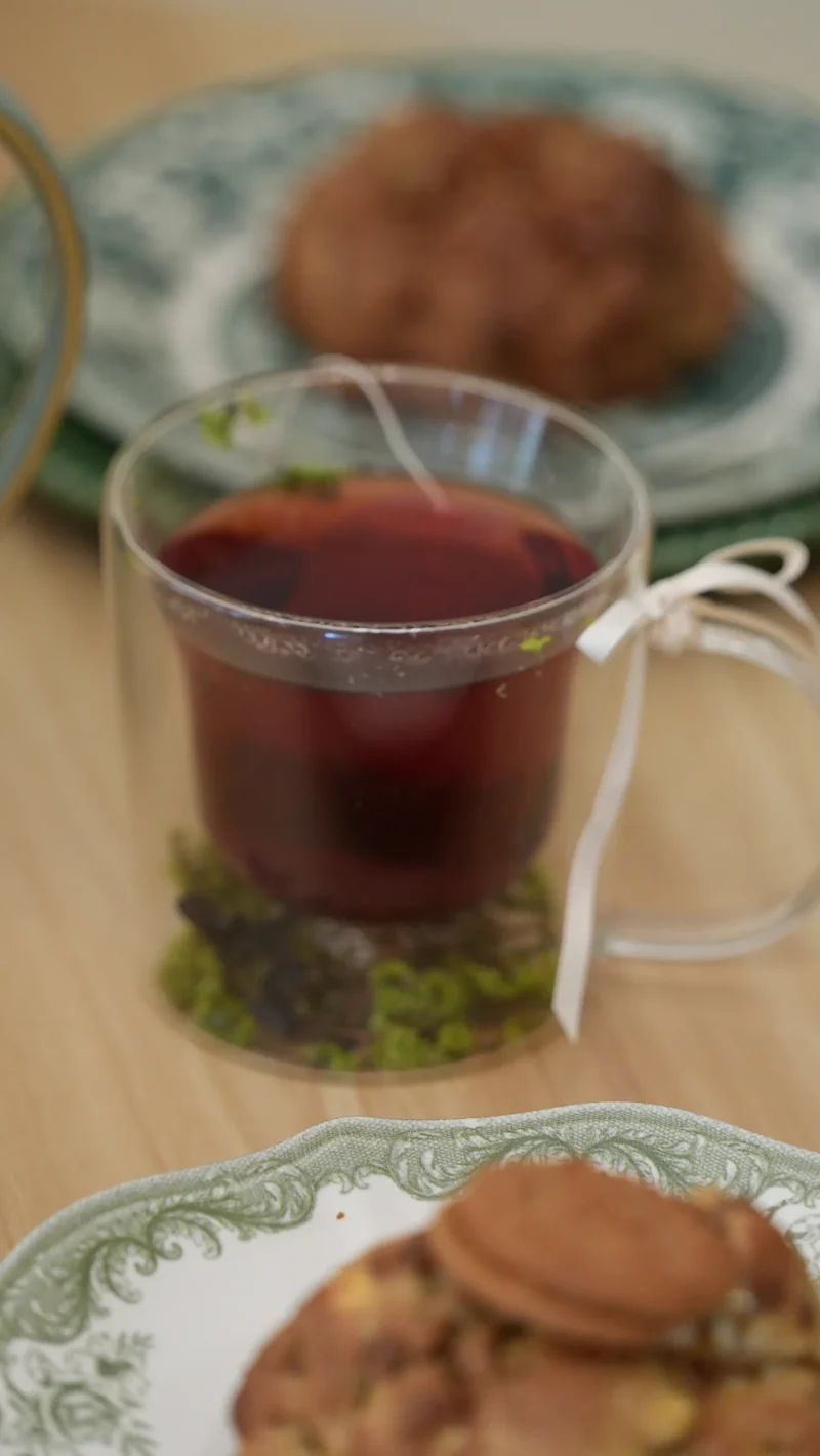 A fragrant tea served beside an artisan pastry at Maison Q.